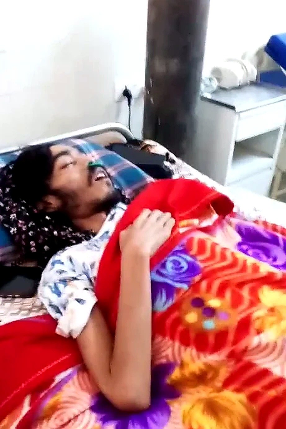 Puran resting in a hospital bed